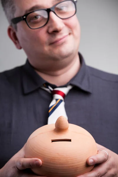 Moneybox shown by accountant — Stock Photo, Image