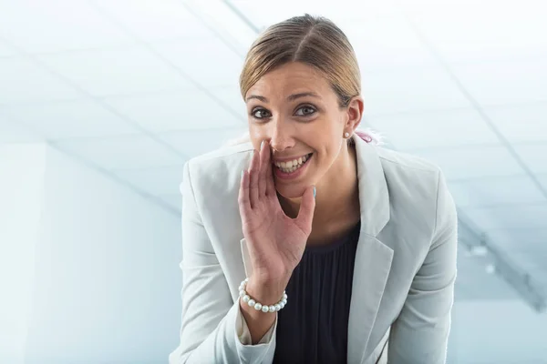 Office worker revealing secrets — Stock Photo, Image