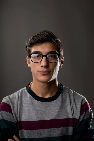 Portrait of a young man with glasses on a jumper — Stock Photo, Image