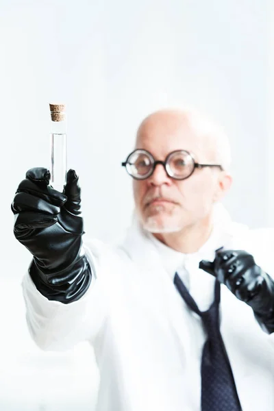 Mad scientist watching his malicious potion — Stock Photo, Image