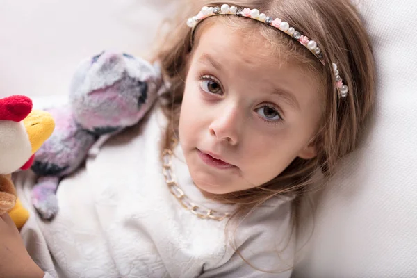 Little girl with a quizzical expression — Stock Photo, Image