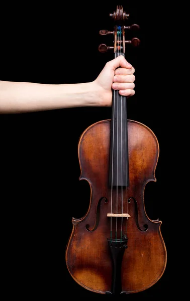 Mano sosteniendo un violín sobre negro —  Fotos de Stock