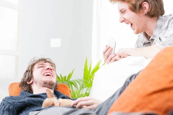 Two young teenage brothers laughing and joking — Stock Photo, Image