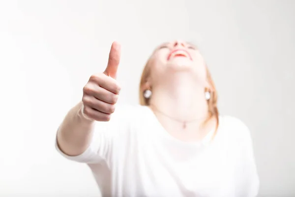 Laughing happy woman giving a thumbs up — Stock Photo, Image