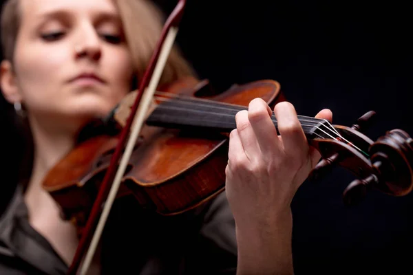 Hand closeup of a violinist on black — Stock Photo, Image