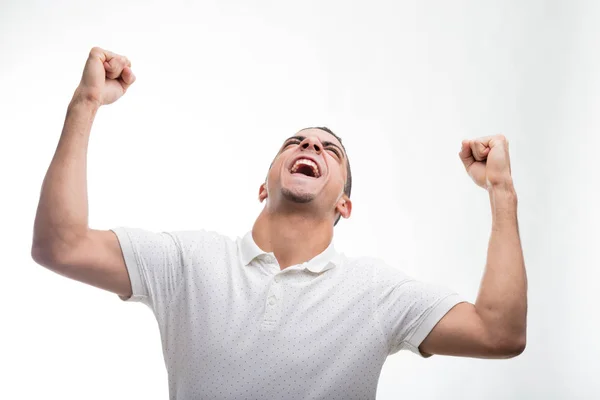 Joven apretando puños en gesto ganador —  Fotos de Stock