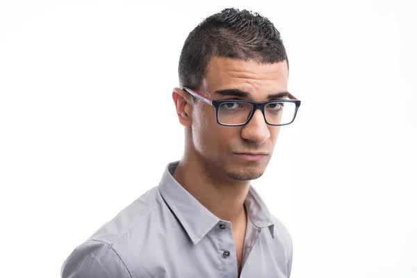 Young sceptical man wearing glasses — Stock Photo, Image