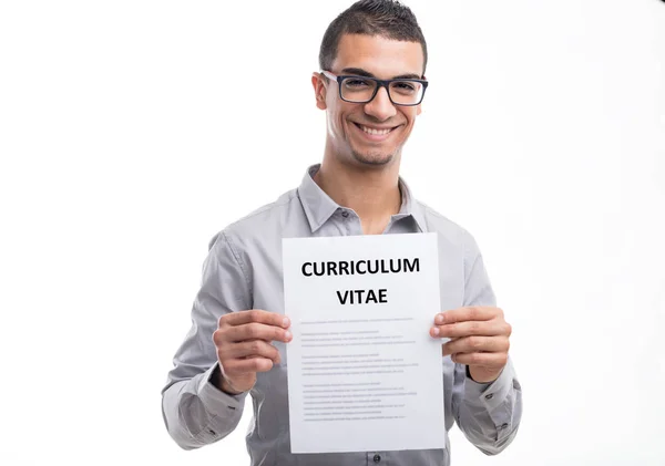 Young smiling man holding curriculum vitae