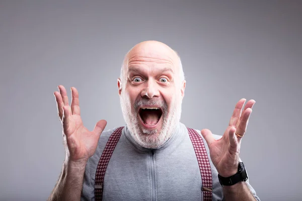 Exaggerated surprise of an old man — Stock Photo, Image
