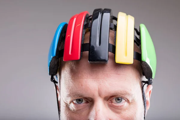 Close up of a bike helmet on an old man — Stock Photo, Image