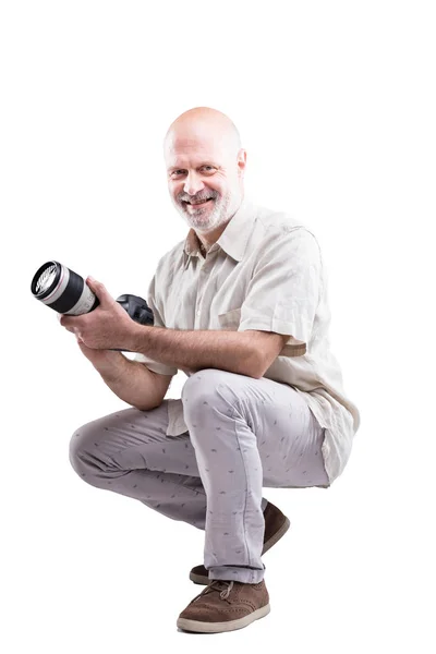 Crouched down professional expert photographer — Stock Photo, Image