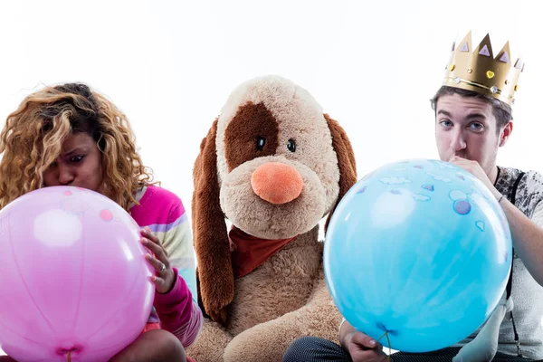 Young Woman Man Blowing Balloons While Sitting Big Stuffed Dog — Stock Photo, Image