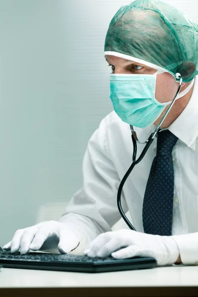 Office Worker Using Mask Gloves Stethoscope While Typing Computer Keyboard — Stock Photo, Image