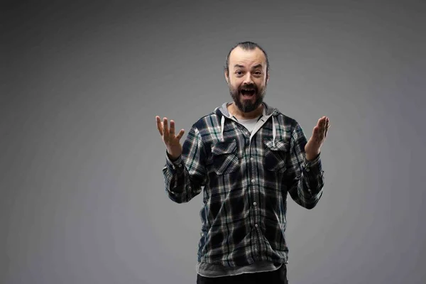 Happy Bearded Man Checked Shirt Showing Surprised Gesture Hands Front — Stock Photo, Image