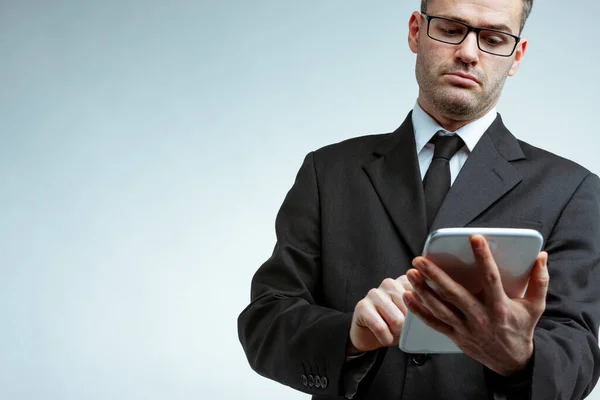 Serious Young Businessman Black Suit Glasses Holding Tablet Computer Looking — Stock Photo, Image