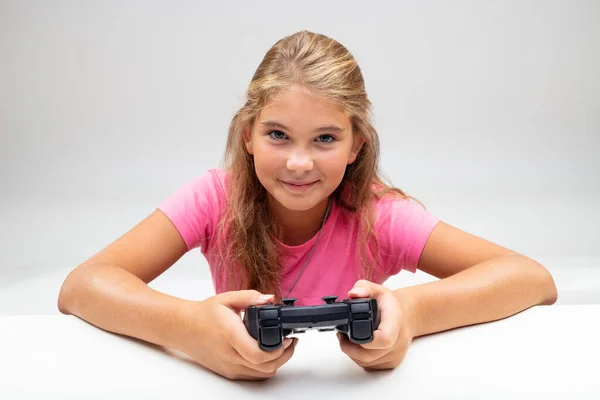 Pretty Little Girl Holding Gaming Console Her Hands She Leans — Stock Photo, Image