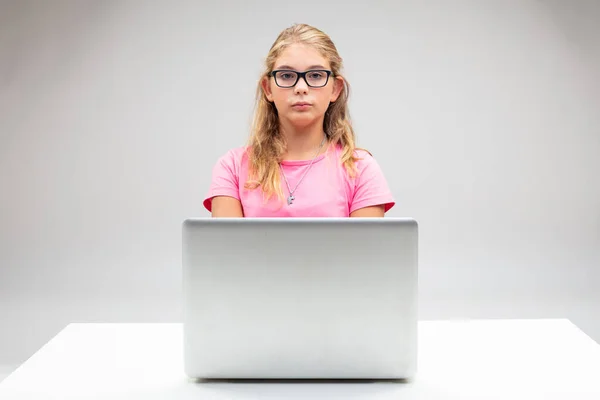 Proud Little Blond Girl Seated Her Laptop Deadpan Stern Expression — Stock Photo, Image