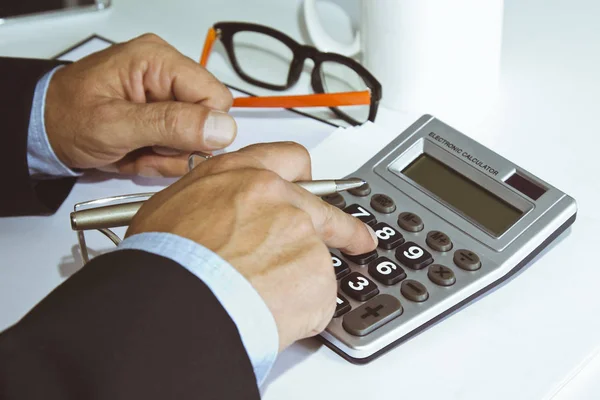 Working with calculator in office — Stock Photo, Image