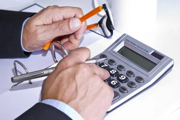 Working with calculator in office — Stock Photo, Image