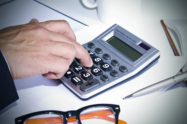 Working with calculator in office — Stock Photo, Image