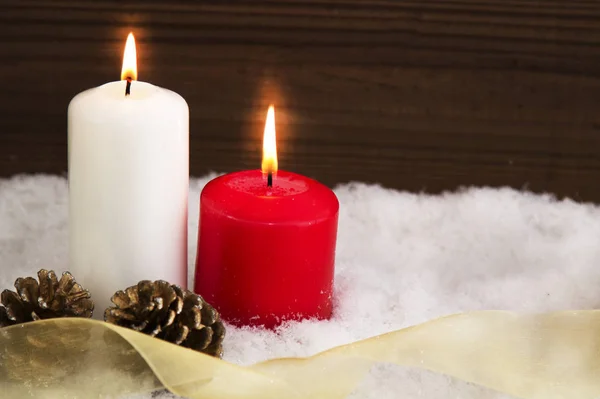 Christmas card with candles and pineapples in the snow — Stock Photo, Image