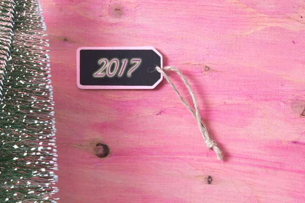 Feliz año nuevo tarjeta sobre fondo rosa —  Fotos de Stock