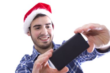 genç adam bir selfie, cep telefonunuzla olma santa Claus şapka ile