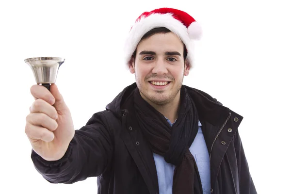 Junger Mann mit Weihnachtsmütze und Glocke hört zu — Stockfoto