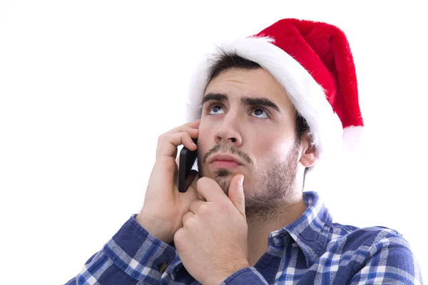 Junger Mann mit Handy und Weihnachtsmütze — Stockfoto