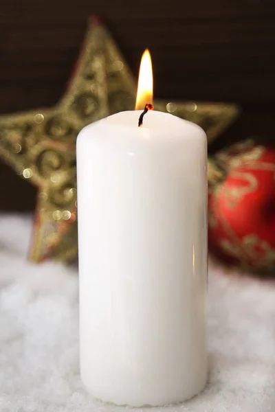 Christmas card with candles on snow — Stock Photo, Image