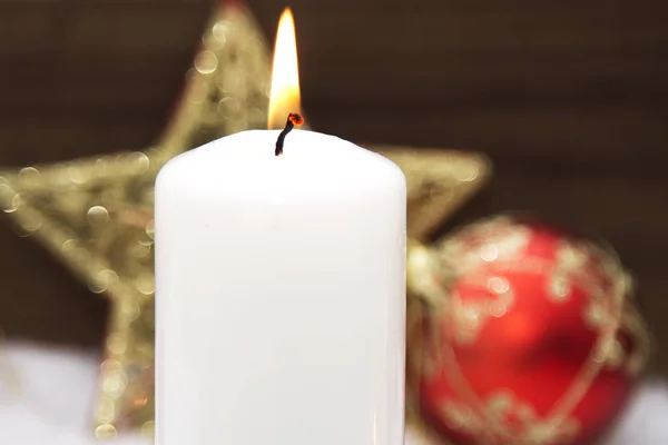 Christmas card with candles on snow — Stock Photo, Image