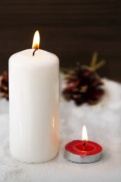 Christmas card with candles on snow — Stock Photo, Image