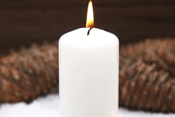 Christmas card with candles on snow — Stock Photo, Image