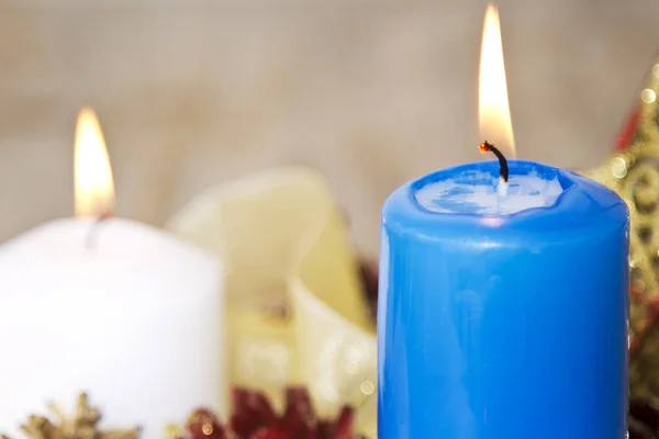 Christmas card with white and blue candles and Christmas decorations — Stock Photo, Image