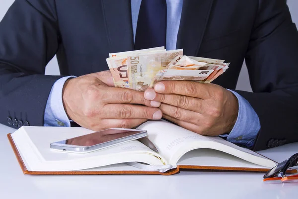 Business man hands grabbing money — Stock Photo, Image