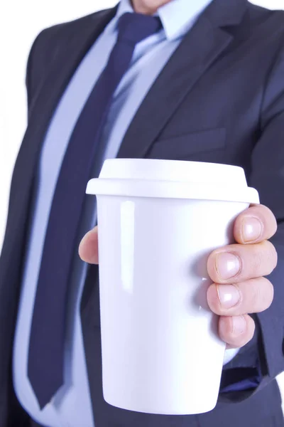 Бизнесмен с кофе на вынос — стоковое фото