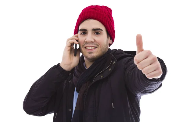 Ung man med mobiltelefon gör ett ok tecken — Stockfoto