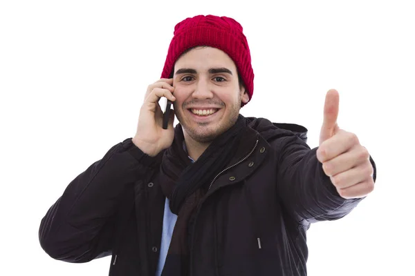 Νεαρός άνδρας με το κινητό τηλέφωνο κάνει το σήμα εντάξει — Φωτογραφία Αρχείου