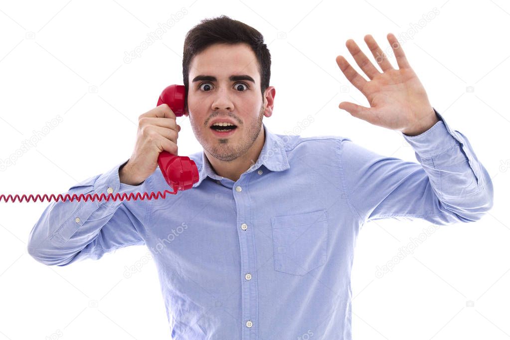 Young man with red phone with surprise expression