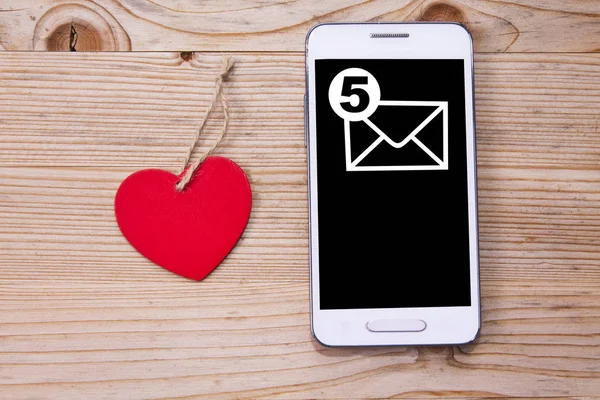 Mobile phone with heart — Stock Photo, Image