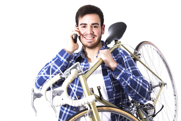 Młody człowiek z rowerem i telefonu komórkowego — Zdjęcie stockowe