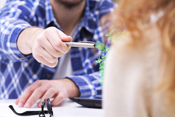 man of business in the office with the documents to the customer or employee
