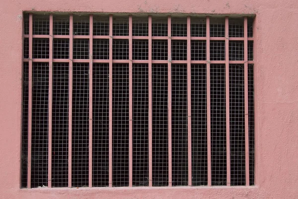 pink window in pink buildings