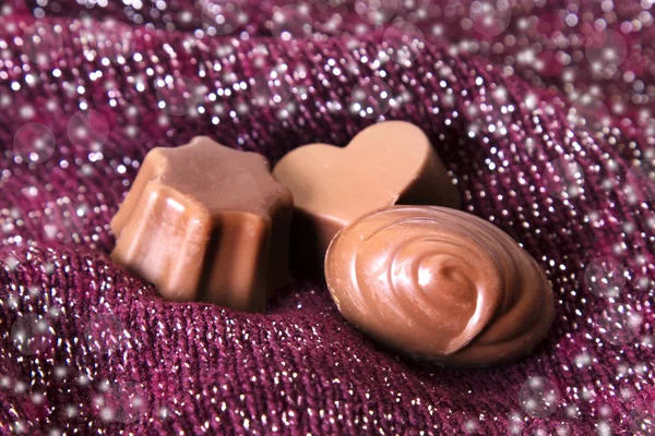 Assortment of chocolate bonbons on bright background — Stock Photo, Image