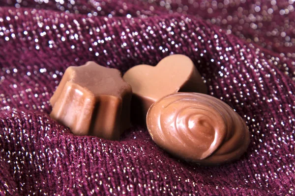 Assortment of chocolate bonbons on bright background — Stock Photo, Image
