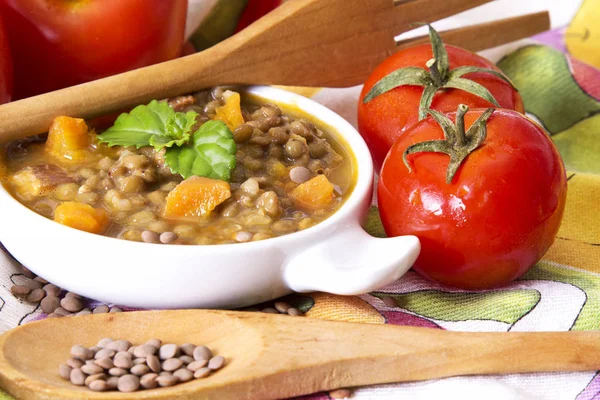 Lentil stew with wooden spoon — Stock Photo, Image