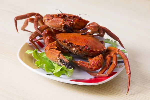 dish of cooked crabs with lettuce