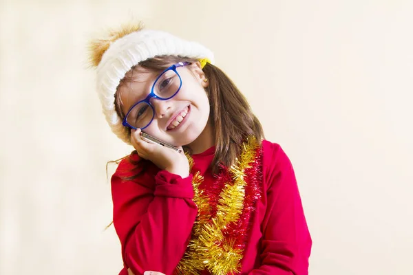 Little Girl Christmas Ribbons Talking Her Mobile Phone — Stock Photo, Image