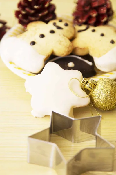 Christmas cookie molds on wooden table and christmas cookies