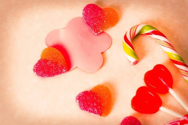 valentines greeting with heart candies and lollipops